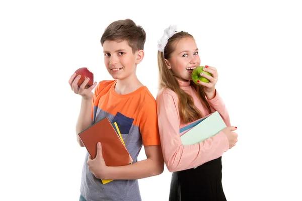 Boy and girl  with textbooks in hand — Stock Photo, Image