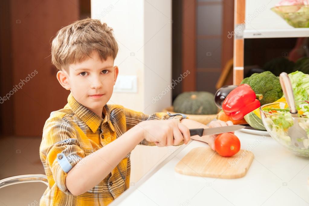 Boy preparing salad