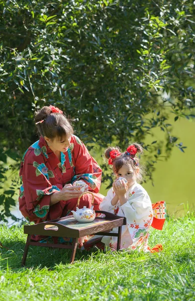 Girl with woman in kimono — Stock Photo, Image