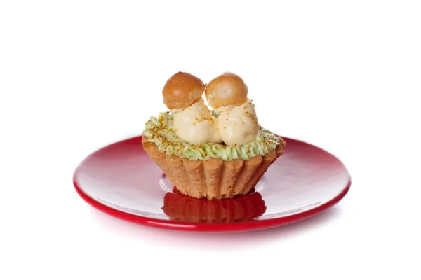 Cakes with butter cream on a plate — Stock Photo, Image