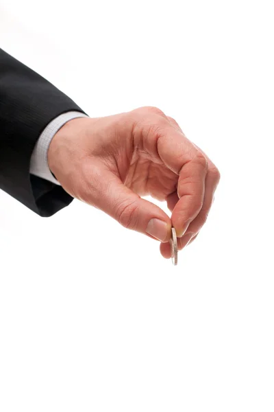 Hand of a businessman with a coin — Stock Photo, Image