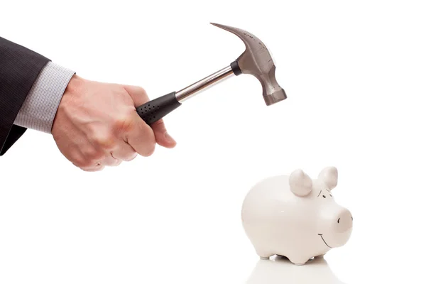 Mannenhand met een hamer en een piggy Bank — Stockfoto