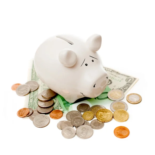 Porcelain pig with coins and banknotes — Stock Photo, Image