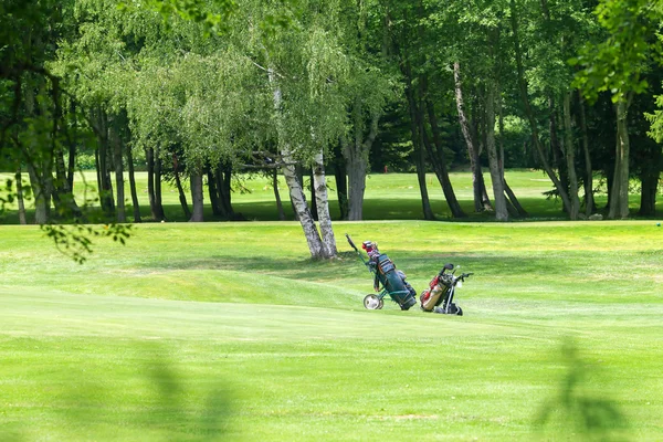 Two carts on a golf course Royalty Free Stock Photos