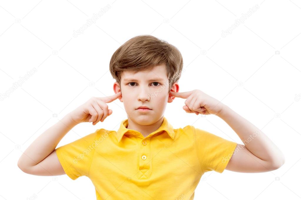Teenage boy plugs ears