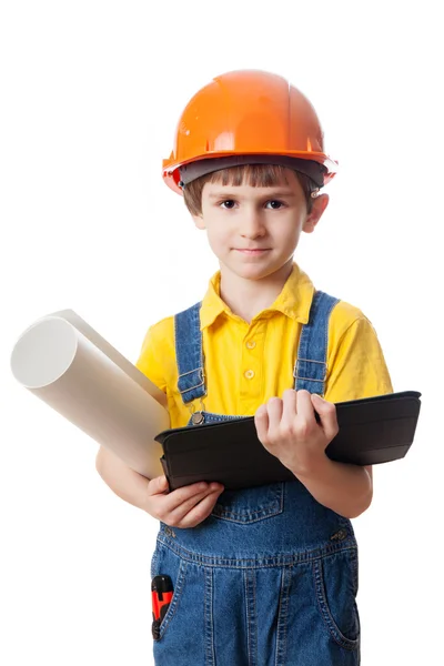 Kleine jongen in veiligheidshelm met blauwdruk — Stockfoto