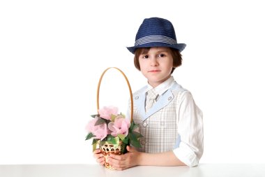 Funny boy in hat with basket of flowers clipart