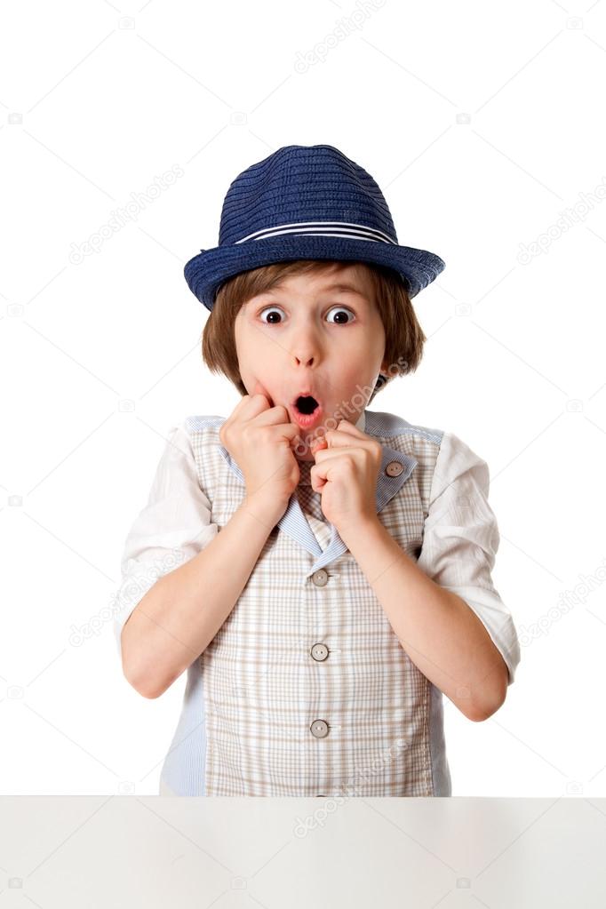 Surprised little boy in hat