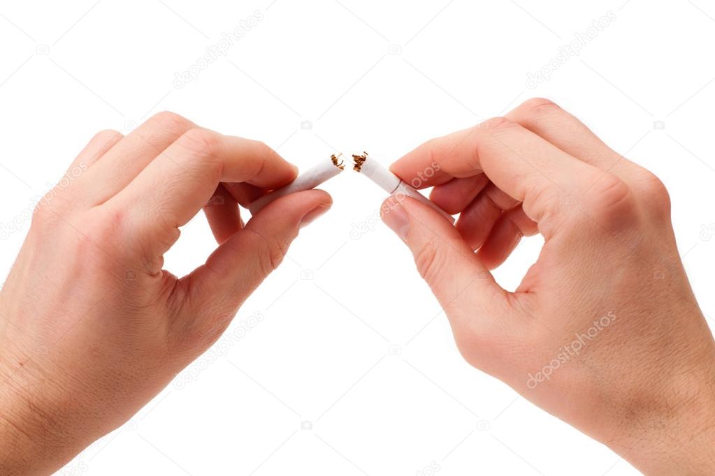 Broken cigarette in man hands