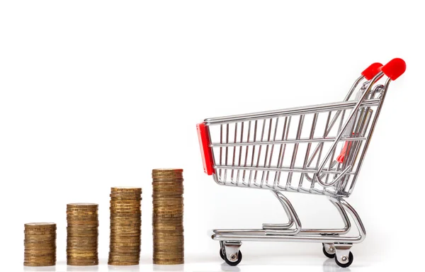 Coins rouleaus and empty shopping cart — Stock Photo, Image