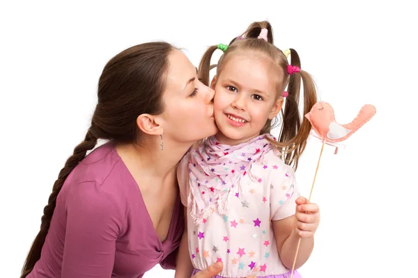 Young woman kissing little girl — Stock Photo, Image