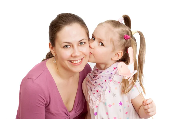 Little girl kissing happy mom — Stock Photo, Image