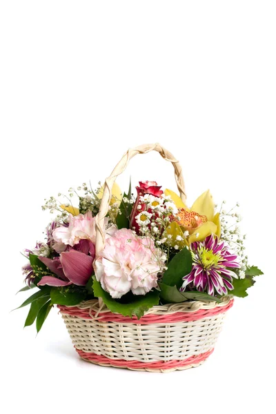 Wicker basket of mixed flowers — Stock Photo, Image