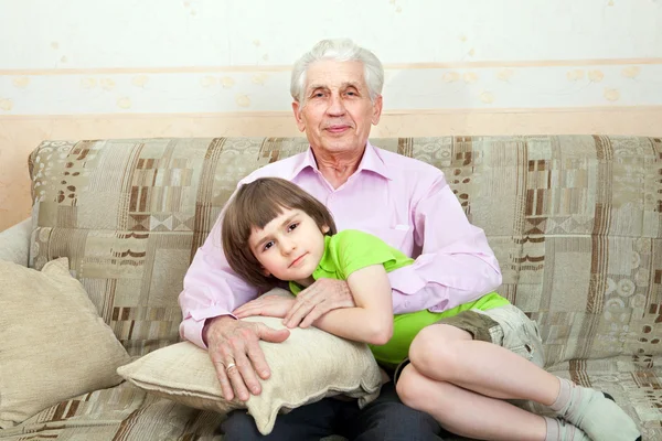 Grandfather with grandson on couch — Stock Photo, Image