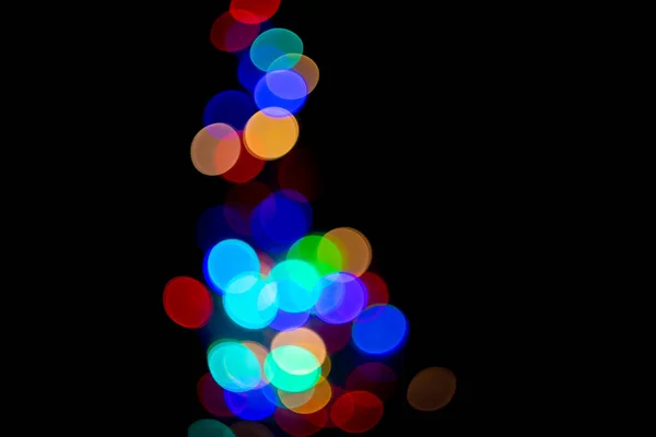 Abstract christmas bokeh background with colorful lights on dark background — Stock Photo, Image