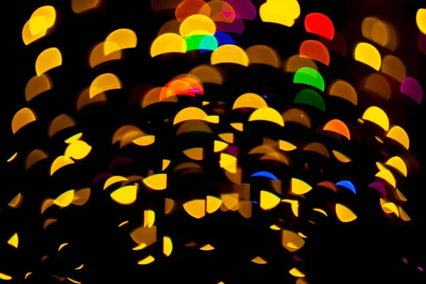 Abstracto navidad bokeh fondo con luces de colores sobre fondo oscuro — Foto de Stock