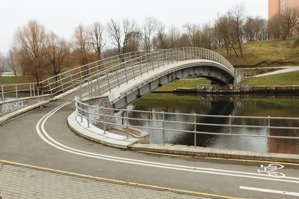 Bicycle bridge over the river — Stock Photo, Image