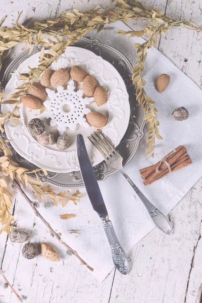 Christmas decoration table servise with almonds, cutlery and oth — Stock Photo, Image