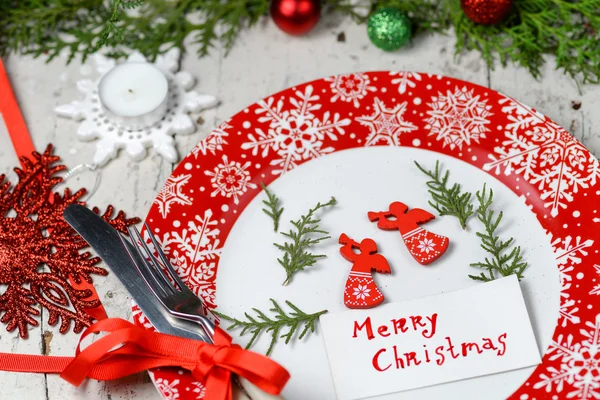 Christmas decoration for the table with red dish and cutlery — Stock Photo, Image