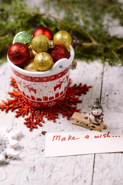 Porcelain bucket with colorful baubles for Christmas and New Yea — Stock Photo, Image