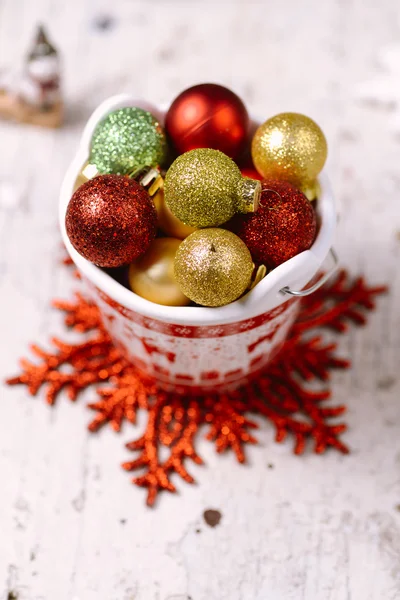 Porcelain bucket with colorful baubles for Christmas and New Yea — Stock Photo, Image