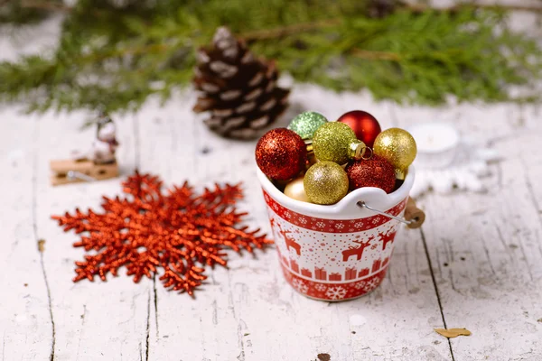 Porcelain bucket with colorful baubles for Christmas and New Yea — Stock Photo, Image