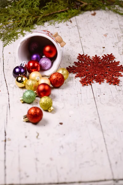 Porcelain bucket with colorful baubles for Christmas and New Yea — Stock Photo, Image