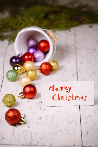 Porcelain bucket with colorful baubles for Christmas and New Yea — Stock Photo, Image