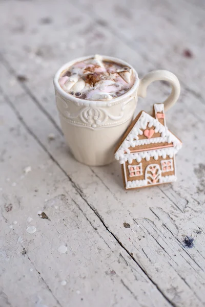 Cocoa mug with marshmallows and ginger cookie winter dream