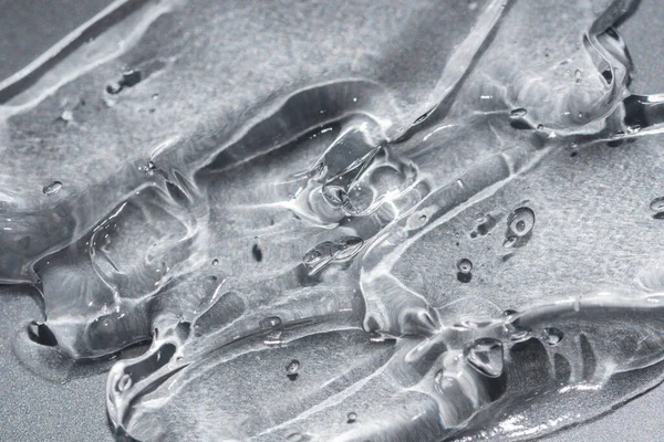Przezroczysty żel tekstury na metalicznym srebrnym tle piękno — Zdjęcie stockowe