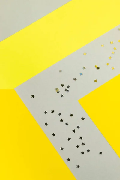 Gul och grå färg block papper bakgrund med silver stjärna konfetti — Stockfoto