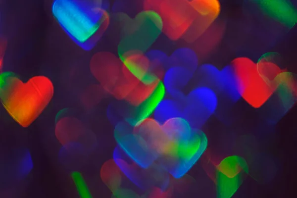 Homályos szív alakú holografikus bokeh fények háttér — Stock Fotó
