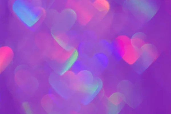 Borrosa corazón en forma holográfica bokeh luces fondo — Foto de Stock