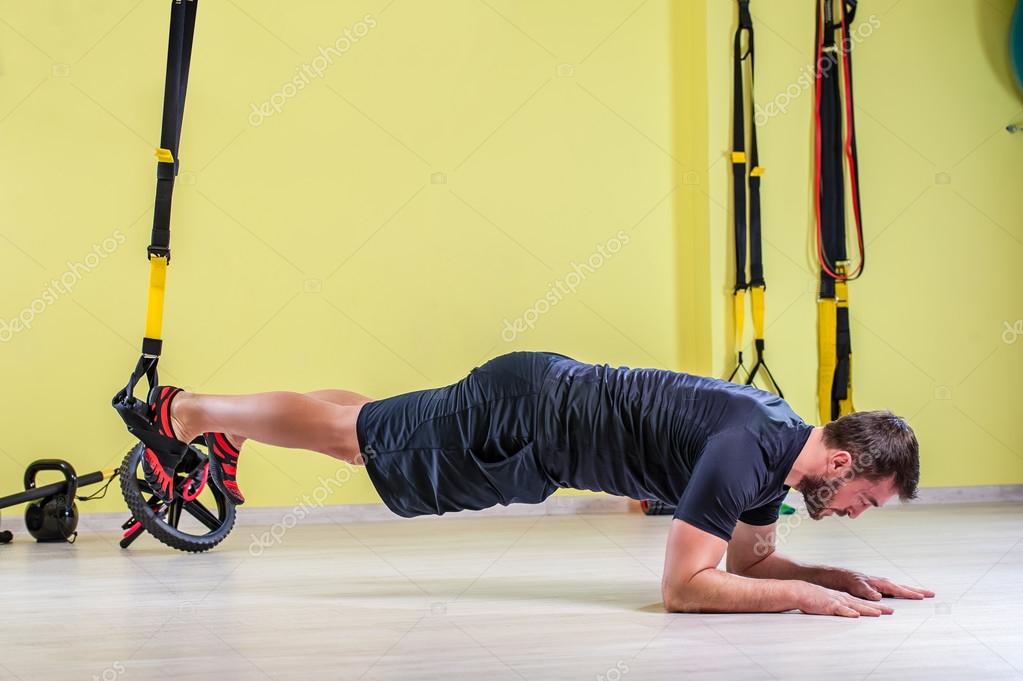 Gym training with trx fitness straps — Stock Photo © vladteodor95