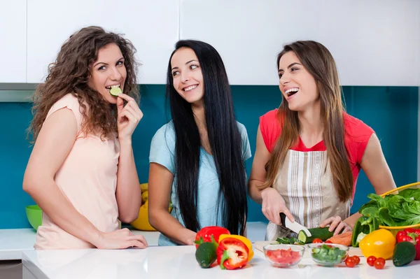 Friendship and healthy lifestyle cooking at home. Stock Image