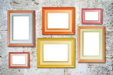 Six multicolored photo frames on the retro wall
