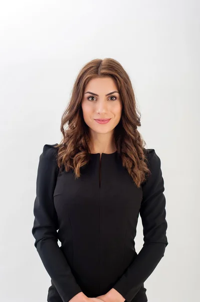 Portrait of a confident young business woman wearing black elegant dress and looking at camera! — Stock Photo, Image