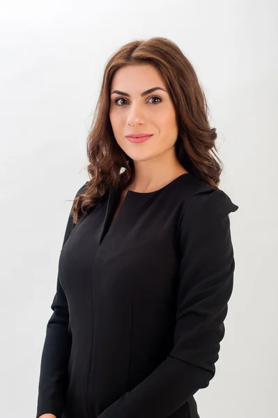 Portrait of a confident young business woman wearing black elegant dress and looking at camera! — Stock Photo, Image