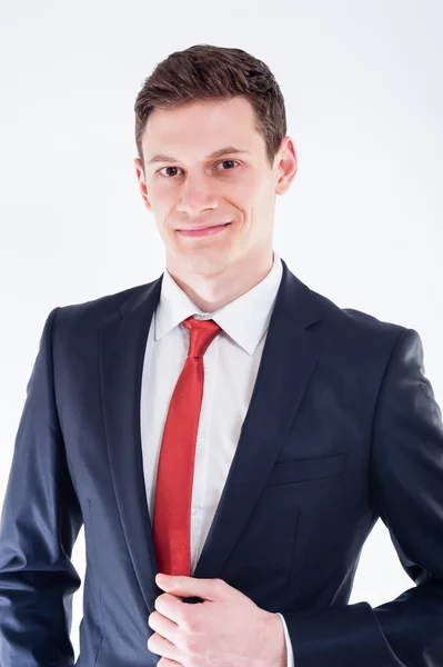 Businessman in black suit and red tie — Stock Photo, Image