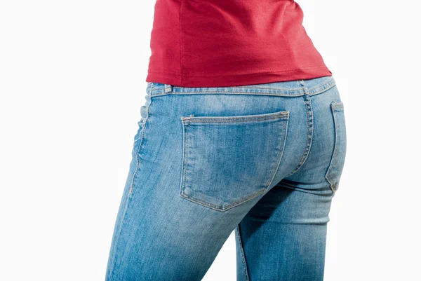 Shot of young woman behind in worn out jeans — Stock Photo, Image