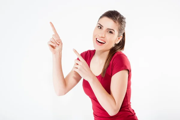 Mujer sonriente apuntando hacia arriba con espacio de copia para producto o texto —  Fotos de Stock