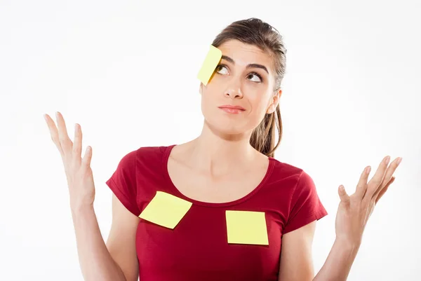 Busy woman against white isolated background with yellow stickers — Stock Photo, Image