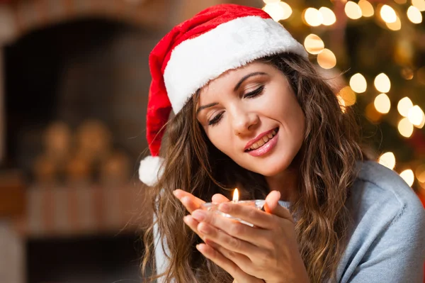 Christmas woman holding a candle — Stock Photo, Image