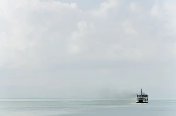 a boat in the calm sea and the nice weather day