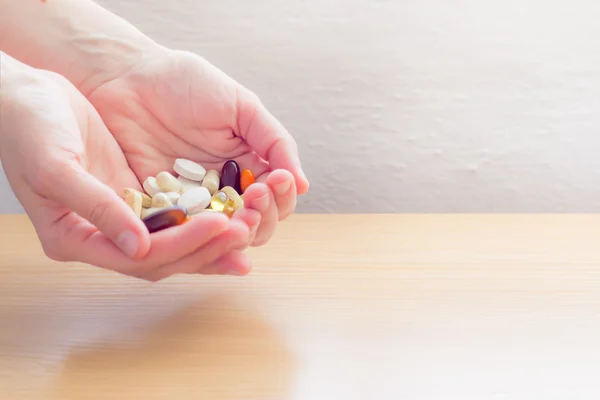 Hands full of pills — Stock Photo, Image