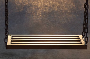 Salıncaklar demirden yapılır ve zincirlerle bağlanır. Güneş ışığını yansıtan arka plan küçük bir turuncu bokeh..