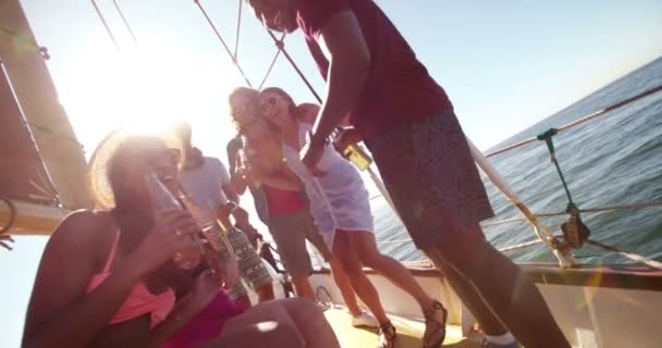 Group of friends toasting with drinks on a yacht — Stock Video