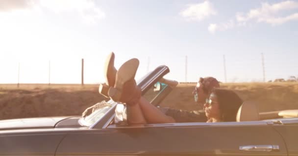 Teenage couple on a road trip with convertible — Stock Video