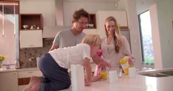 Family Standing and Having Breakfast in Kitchen — Wideo stockowe