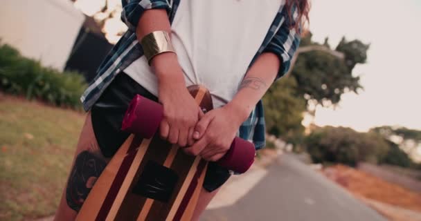 Skater girl standing with her board — Stock Video